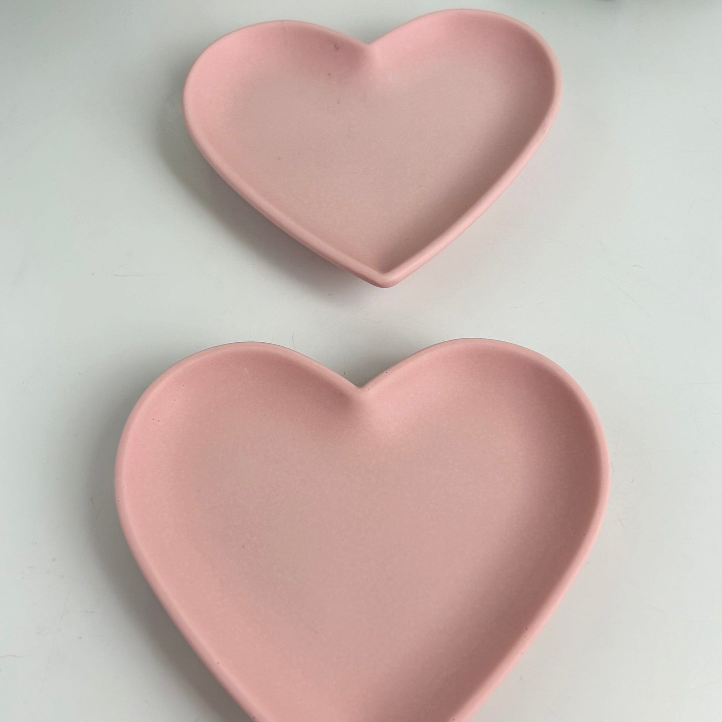 A pair of heart shaped trays