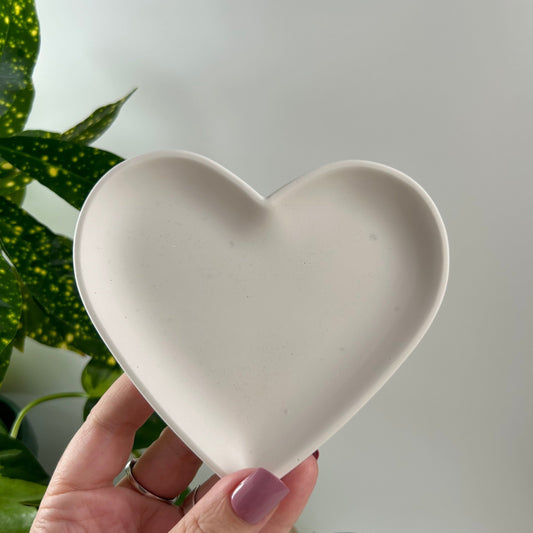 A pair of heart shaped trays